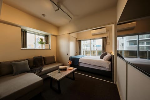 Bed, Living room, Seating area, Bedroom