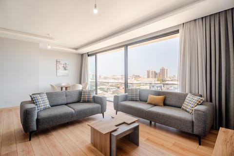 View (from property/room), Balcony/Terrace, Living room, Photo of the whole room, Seating area, City view, air conditioner