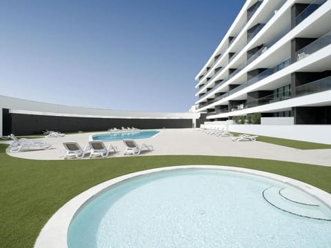 Property building, Pool view, Swimming pool, sunbed