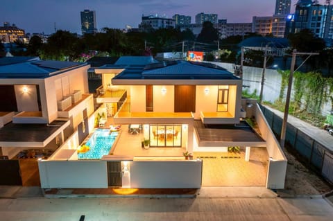 Property building, Patio, Night, View (from property/room), Balcony/Terrace, Living room, Seating area, City view, Pool view, Swimming pool