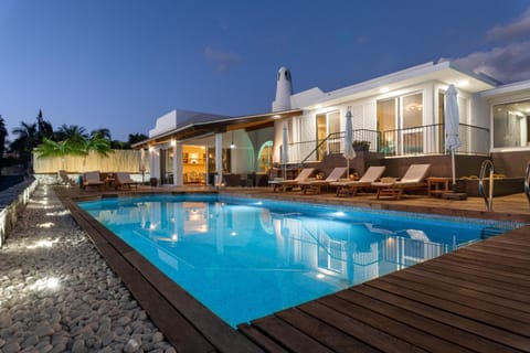 Property building, Patio, Pool view, Swimming pool, sunbed
