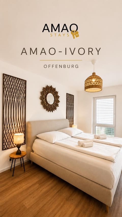 Bed, Property logo or sign, Photo of the whole room, Logo/Certificate/Sign, Bedroom, Text overlay, Certificate/Award, towels