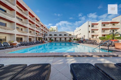 Property building, Patio, Communal lounge/ TV room, Day, Evening entertainment, Pool view, Swimming pool, Location, sunbed