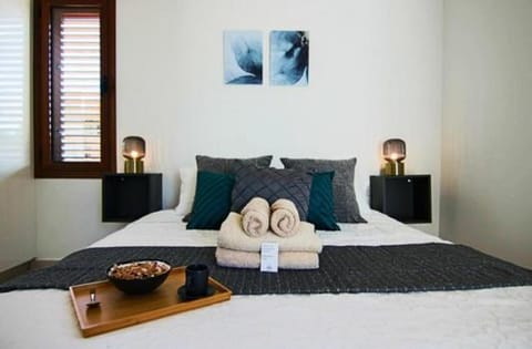 Bed, Bedroom, hair dryier, towels, wardrobe, air conditioner