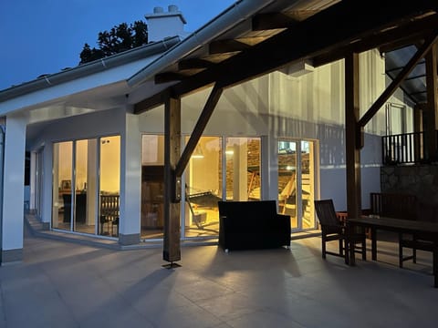 Property building, Patio, Night, View (from property/room), Balcony/Terrace, Living room, Seating area