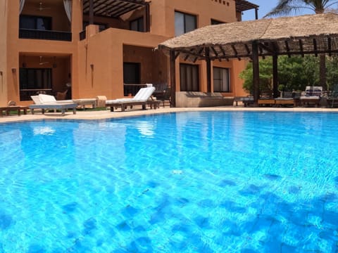 Property building, Patio, Day, Pool view, Swimming pool, sunbed