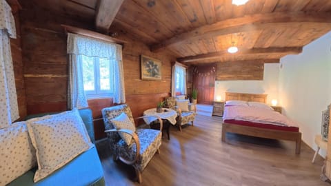 Bed, Living room, Seating area, Bedroom
