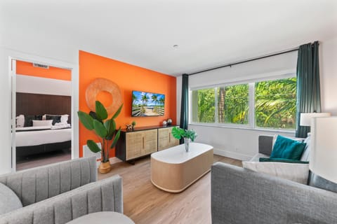 Bed, TV and multimedia, Living room, Seating area, Garden view