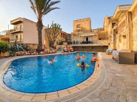 Property building, Day, People, Pool view, Swimming pool, children, group of guests, sunbed