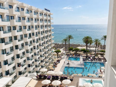 Property building, Patio, Day, View (from property/room), Balcony/Terrace, Beach, Evening entertainment, Pool view, Sea view, Swimming pool, sunbed
