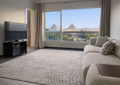 Communal lounge/ TV room, Bed, Natural landscape, TV and multimedia, View (from property/room), Balcony/Terrace, Living room, Photo of the whole room, Seating area, Evening entertainment, Bedroom