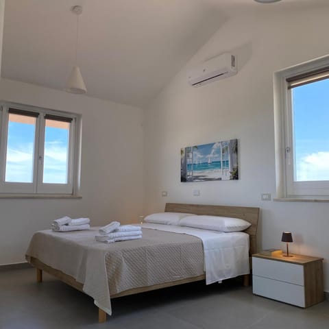 Photo of the whole room, Bedroom, towels, air conditioner