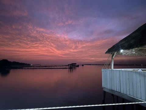 Property building, Restaurant/places to eat, Natural landscape, River view, Sunset