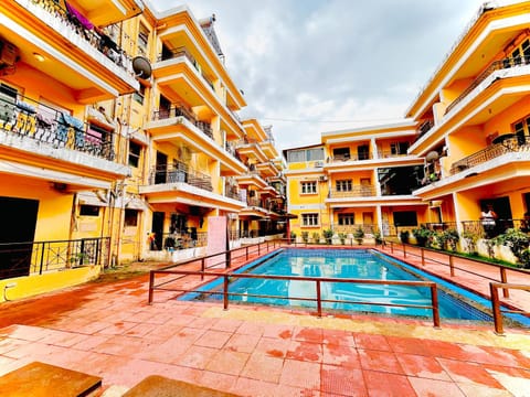 Property building, Day, Neighbourhood, View (from property/room), Balcony/Terrace, Pool view, Street view, Swimming pool, sunbed
