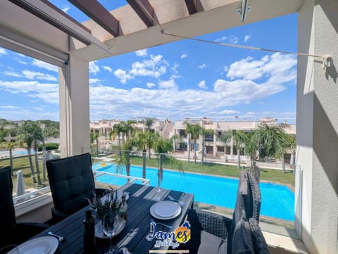View (from property/room), Balcony/Terrace, Dining area, Swimming pool