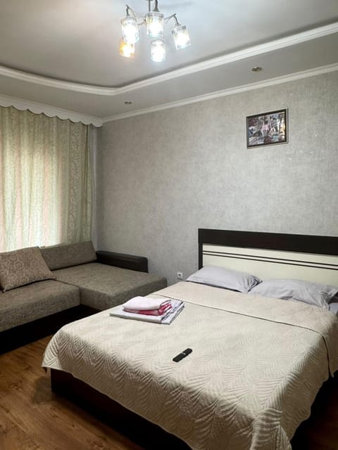 Bed, Living room, Seating area, Bedroom