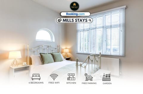 Bed, Property logo or sign, Living room, Photo of the whole room, Seating area, Logo/Certificate/Sign, Bedroom, Text overlay, Certificate/Award
