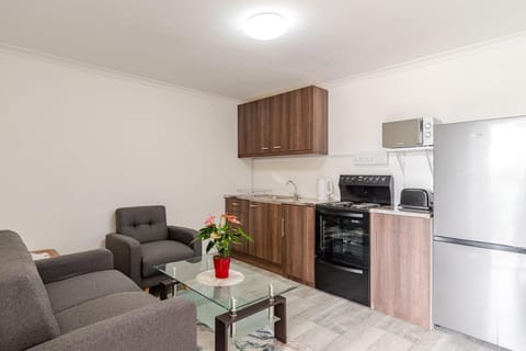Kitchen or kitchenette, Living room, Seating area, Dining area, oven, stove, toaster