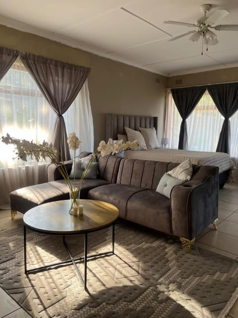 Bed, Living room, Seating area, Bedroom