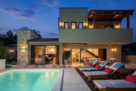 Property building, Patio, Night, Balcony/Terrace, Seating area, Pool view, Swimming pool, sunbed