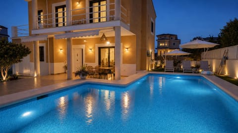 Property building, Patio, Night, Pool view, Swimming pool, Swimming pool, sunbed