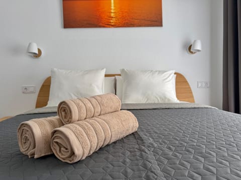 Bed, Bedroom, Text overlay, towels