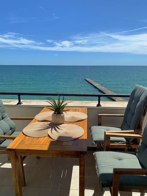 View (from property/room), Balcony/Terrace, Seating area, Beach, Sea view