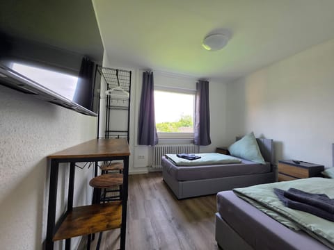 Bed, TV and multimedia, Photo of the whole room, Seating area, Bedroom, furniture, storage, towels, wardrobe