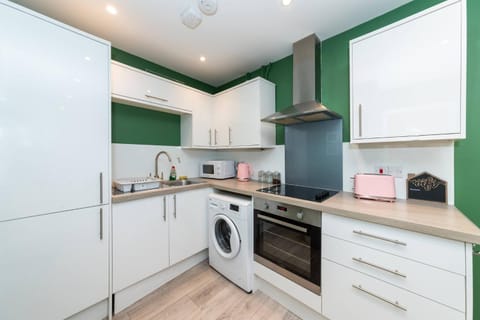 microwave, oven, laundry, washing machine, kitchen