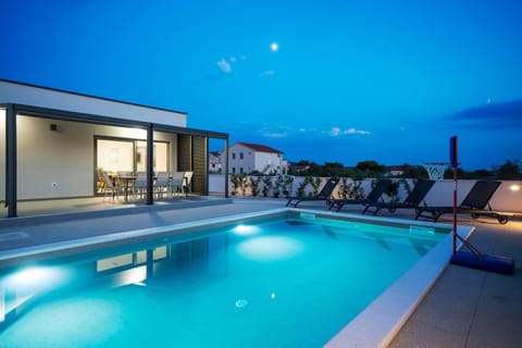Patio, Night, Pool view, Swimming pool, sunbed