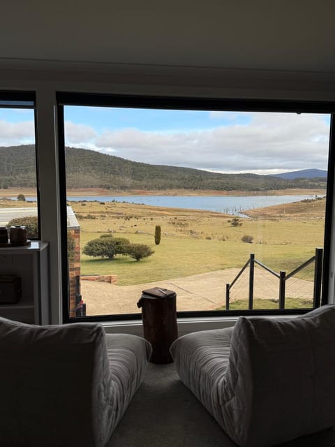 Natural landscape, View (from property/room), Living room, Seating area, Lake view, Mountain view