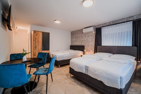 Bed, TV and multimedia, Seating area, Bedroom, air conditioner