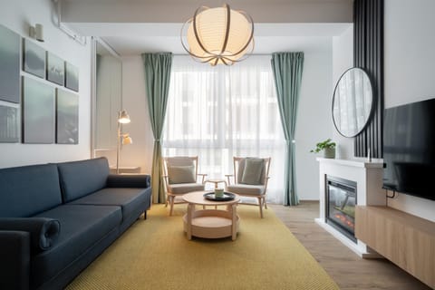 Bed, TV and multimedia, Kitchen or kitchenette, Living room, Photo of the whole room, Seating area, Bedroom