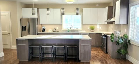 Kitchen or kitchenette, dishwasher, oven, stove