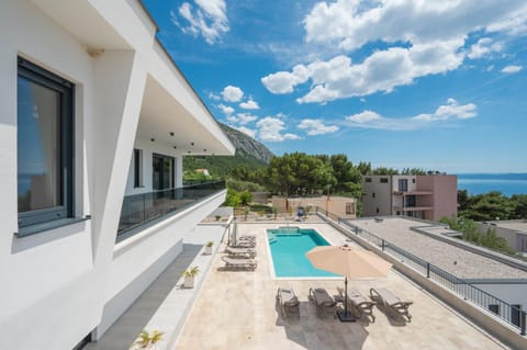 Property building, Patio, Day, Natural landscape, View (from property/room), Balcony/Terrace, Pool view, Sea view, Swimming pool, sunbed