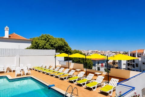 Property building, Day, Pool view, Swimming pool, sunbed