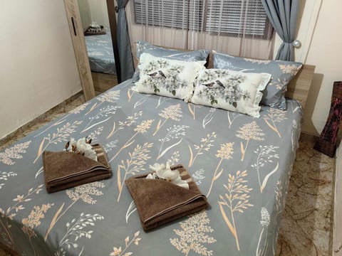 Bed, Seating area, Bedroom, towels, wardrobe