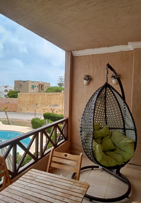 Patio, Day, View (from property/room), Balcony/Terrace, Living room, Seating area, Pool view