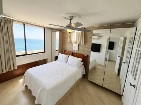 Bed, Natural landscape, TV and multimedia, Bedroom, Sea view, wardrobe