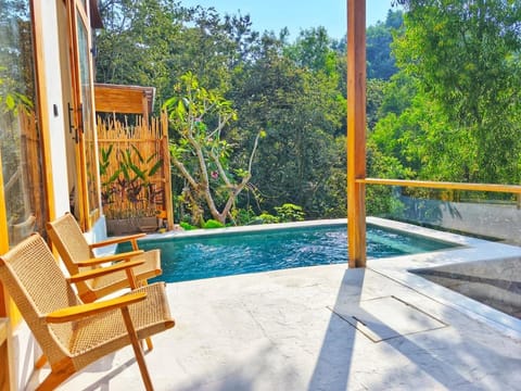 Patio, Day, Natural landscape, Pool view, Swimming pool, sunbed