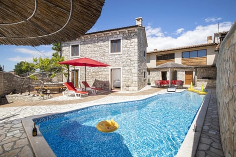 Property building, Patio, Swimming pool, sunbed