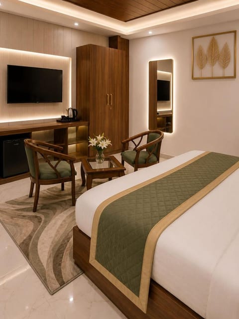 Property building, Communal lounge/ TV room, Bed, TV and multimedia, Living room, Photo of the whole room, Seating area, Evening entertainment, Bedroom, hair dresser