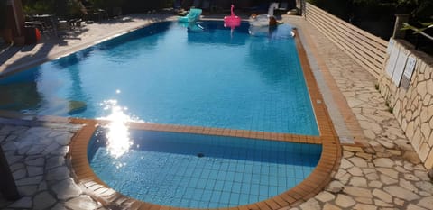 Property building, Living room, Swimming pool