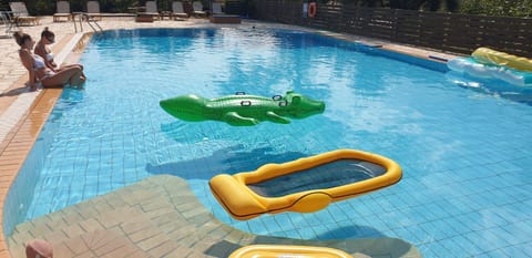 Property building, Living room, Swimming pool
