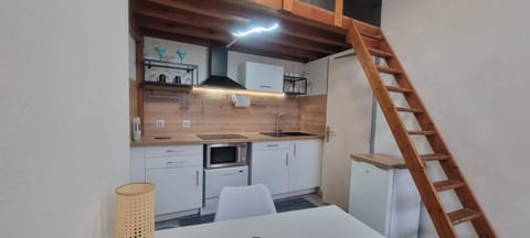 Kitchen or kitchenette, dishwasher, oven, stove