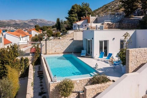 Property building, Patio, Facade/entrance, Day, Pool view, Sea view, Swimming pool, sunbed