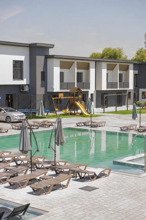 Property building, Day, Pool view, sunbed