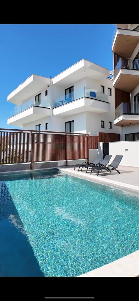 Property building, Balcony/Terrace, Pool view, Swimming pool