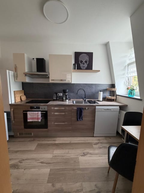 Kitchen or kitchenette, dishwasher, oven, stove, toaster