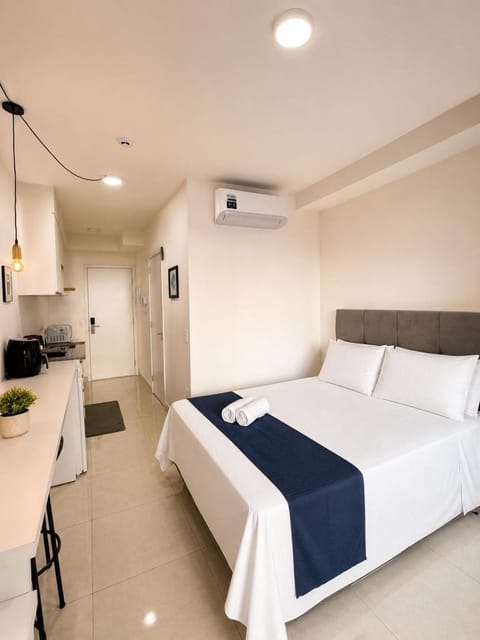Bed, Photo of the whole room, Bedroom, towels, air conditioner